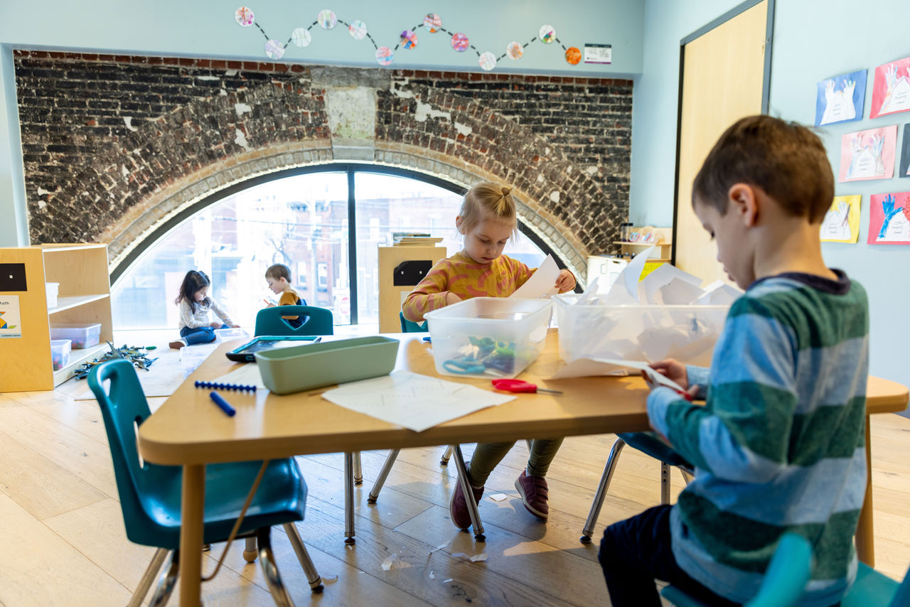 Kindergarten students working independently to complete task