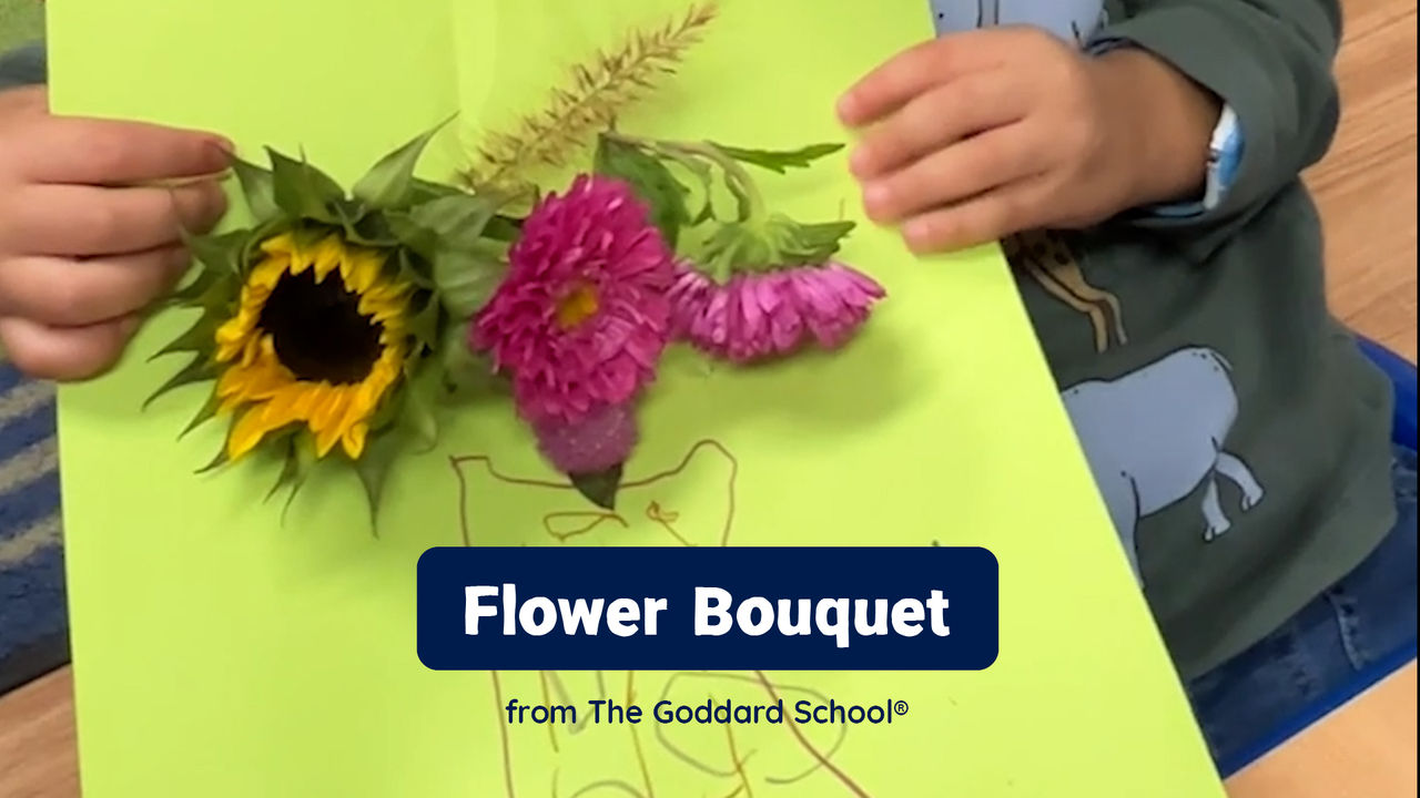 Child showing off their mother's day bouquet craft