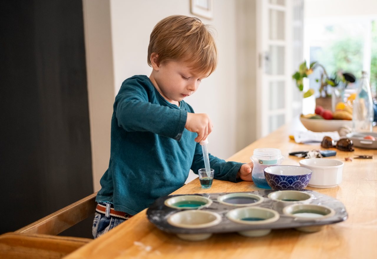 child making a science project