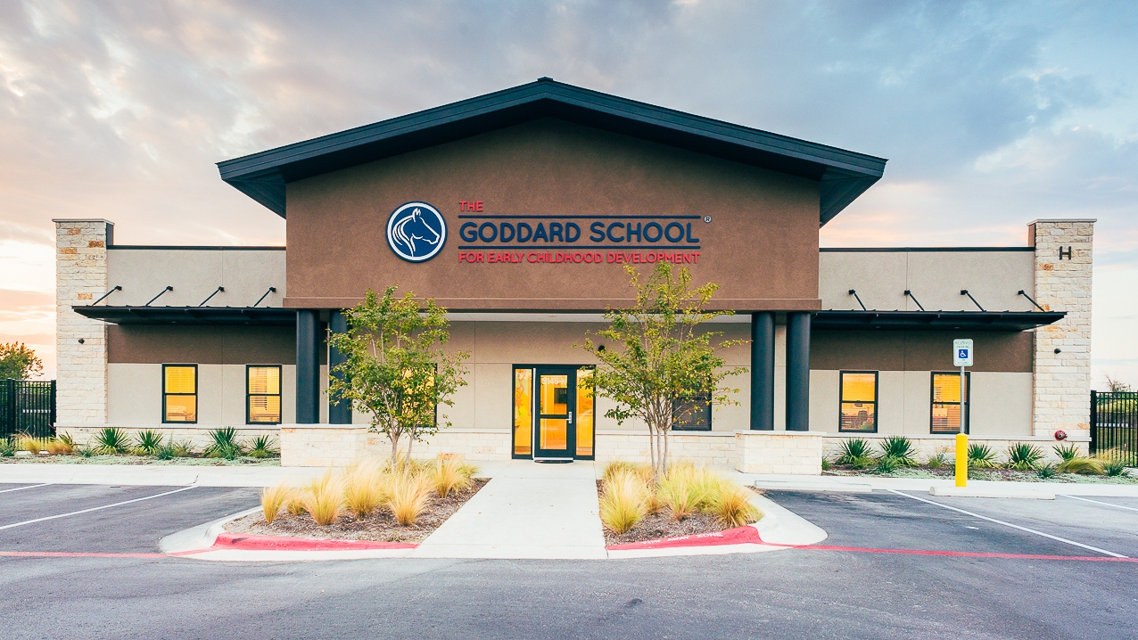 The exterior of The Goddard School in Steiner Ranch Texas, at sunset.
