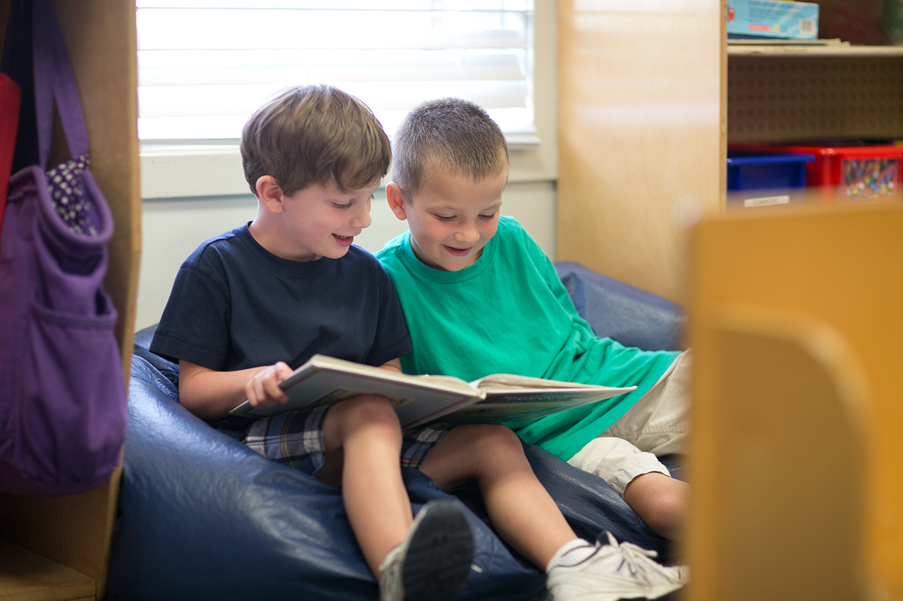 Two students learning to read together